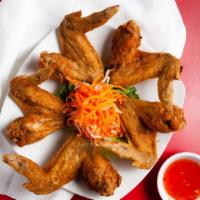 Whole Fried Chicken Wings (5) · Deep-fried in-house-marinated whole wings. Served with mixed sweet chili sauce.