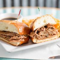 French Dip & Side · Sliced roast beef piled high on a baked French roll with au jus.