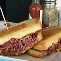 Hot Pastrami Sandwich & Side · Pastrami, swiss cheese and mustard on grilled sour dough.
