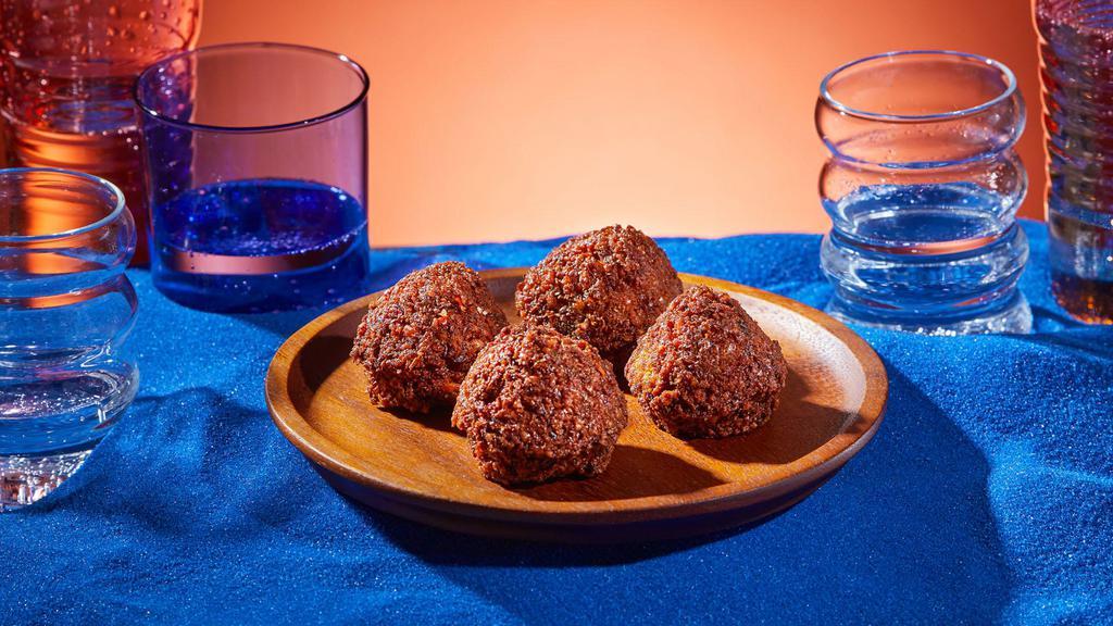 Falafel (4pc) · Ground chickpeas with garlic and herbs, deep-fried.