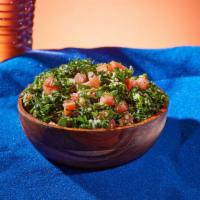 Tabbouleh · Bulgur wheat with parsley, tomatoes, onions, olive oil, and lemon juice.