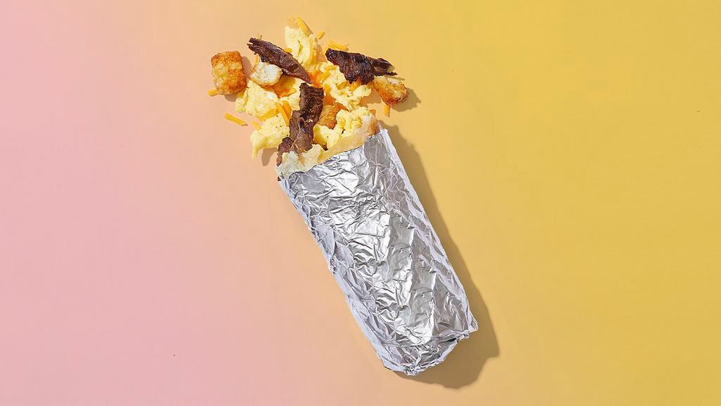 Authentic Af · Tender carne asada, scrambled eggs, melted cheese, crispy tater tots, wrapped in a flour tortilla.