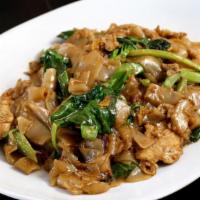 Pad C U · Wok fried flat rice noodles with eggs and Chinese broccolis in dark soy sauce.