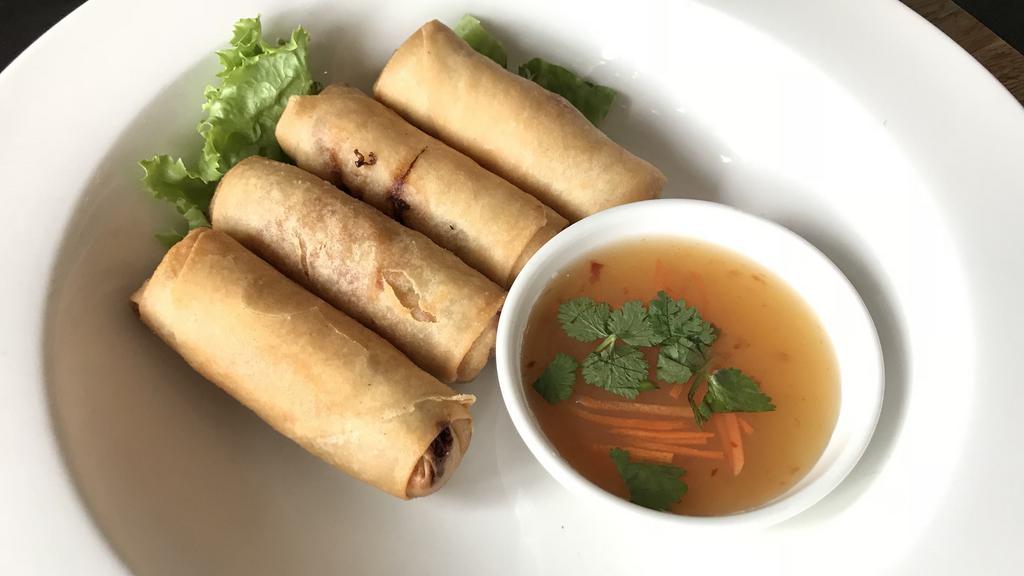 Crispy Egg Rolls · Thai-style vegetable egg rolls with sweet and sour sauce.