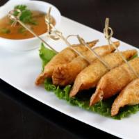 Cream Cheese Taffies · Crispy wontons filled with cream cheese, crab meat and green onion with sweet and sour.