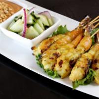Skewers · Served with peanut sauce and sweet and sour.