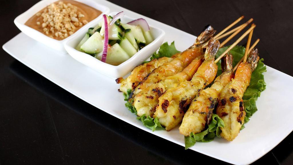 Skewers · Served with peanut sauce and sweet and sour.
