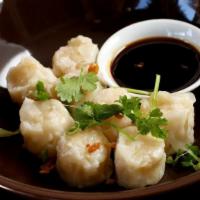 Shumai · Steamed or fried. Dumplings filled with smoothly minced prawns and spices; with seasoned soy...