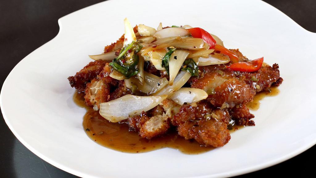 Crispy Chicken / Crispy Chicken with Basil · Marinated crispy chicken; served with side salad and sweet Thai chili OR Spice level 2 crispy chicken sautéed with onions, red bell peppers and sweet basil leaves in krua’s special hot chili sauce.