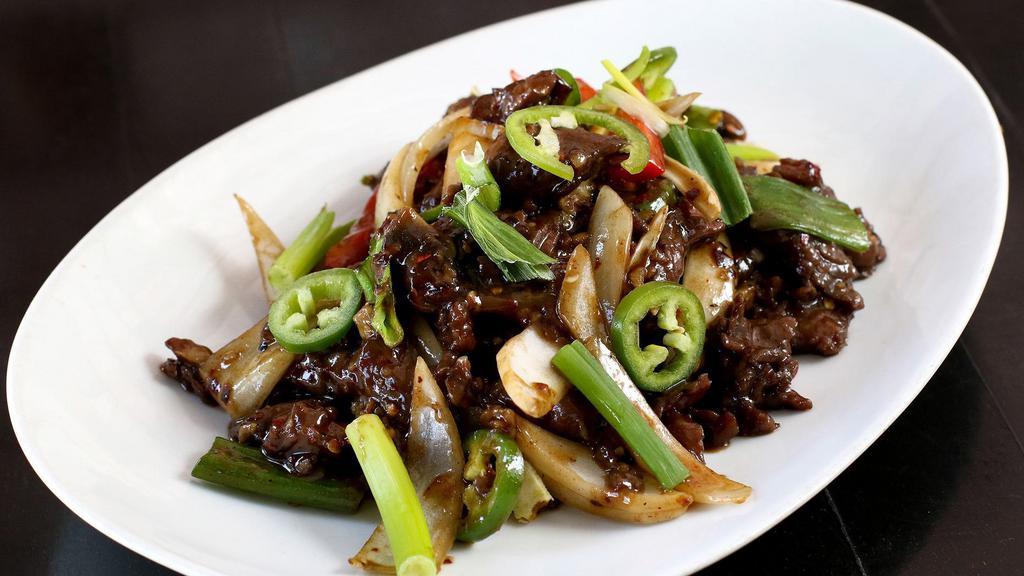 Krua's Zesty Beef · Spice level 3. Marinated sliced beef lightly sautéed with onions, mushrooms, red bell peppers and jalapeño in hot chili sauce.