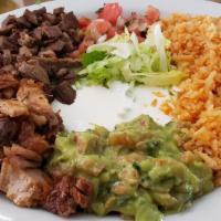 Carne Asada Plate · Chopped grilled steak.With rice refried beans lettuce salsa guacamole sour cream and corn to...