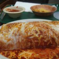 Burrito Mojado · Choice of Meat, Rice, Refried Beans, Onion, Cilantro, Lettuce, Jack Cheese, Guacamole Sauce,...