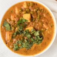 Mattar Paneer · Cottage cheese cooked with green peas royal cumin, ginger, garlic and tomatoes.