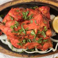 Tandoori Chicken · Chicken leg quarters marinated in yogurt and blend of spices and cooked in clay oven.