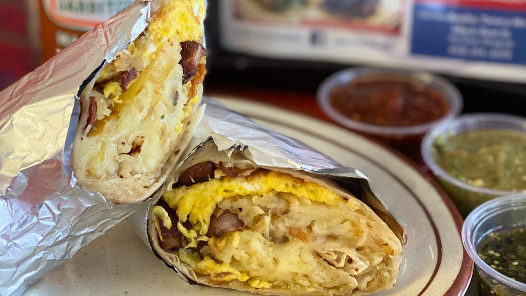Breakfast Burrito · Scrambled eggs mixed with Hashbrowns, and your choice of Bacon, Sausage, or Ham.
