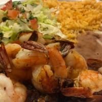 Camarones al Mojo de Ajo · Shrimp cooked in a butter and garlic sauce. Served with your choice of Tortillas.
