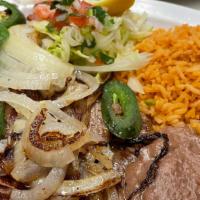 Carne Asada · Grilled Thin Steak, served with Grilled Onions, Peppers, Rice, Beans, and your choice of Tor...