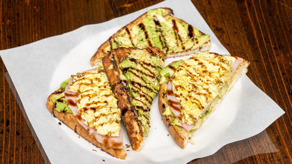 Avocado Toast · Avocado, Roma Tomato, and Balsamic drizzle on your choice of toast. Topped with sea salt and cracked black pepper.