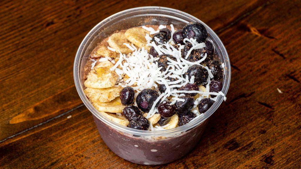 Acai Bowl · Acai berry puree with blueberries, strawberries, coconut and banana. Topped with fresh strawberries, banana, blueberries, coconut, granola, honey and a dash of chocolate powder. (VEGAN)