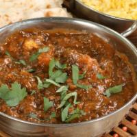 Halal Saag Lamb · Flavorful halal lamb and spinach stew loaded with fresh ground traditional spices served wit...