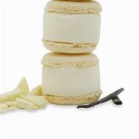 Vanilla White Chocolate Macaron Cheesecake · Vanilla’s floral, warm notes pair perfectly with decadent white chocolate and real cream che...