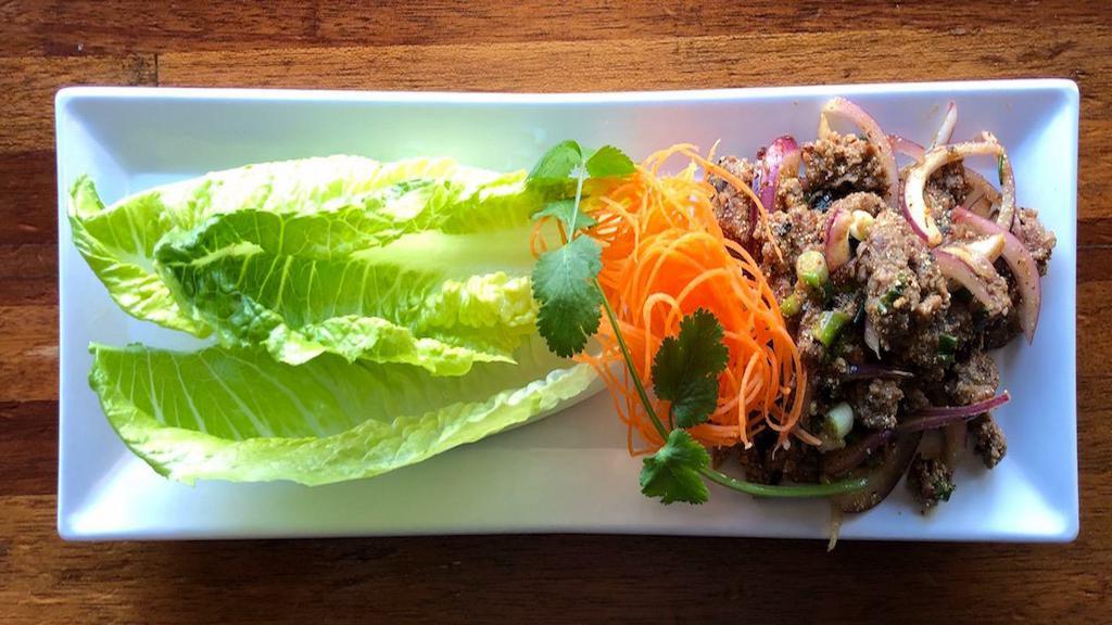 Larb Impossible · Ground Impossible meat, sliced red onion, mint leaves tossed in chili-lime dressing. Gluten-free.

Vegan (no fish sauce) option available upon request.