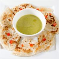 Roti with Green Curry · Vegan. Pan fried roti (Asian pita bread) served with green curry dipping sauce, garnished wi...