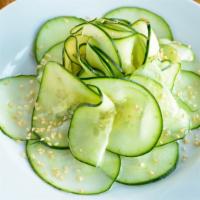 Cucumber Salad · Gluten-free and vegan. Garnished with sesame seeds and bell pepper.
