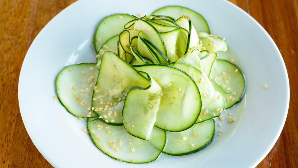 Cucumber Salad · Gluten-free and vegan. Garnished with sesame seeds and bell pepper.