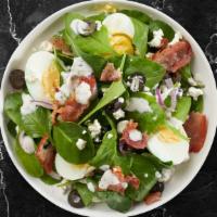 Popeye's Salad · Spinach, feta, bacon, pesto, onion, olives, 2 hard-boiled eggs, house dressing.