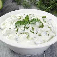 Tzatziki Salad · Cucumber yogurt mixed with mint, garlic and lemon