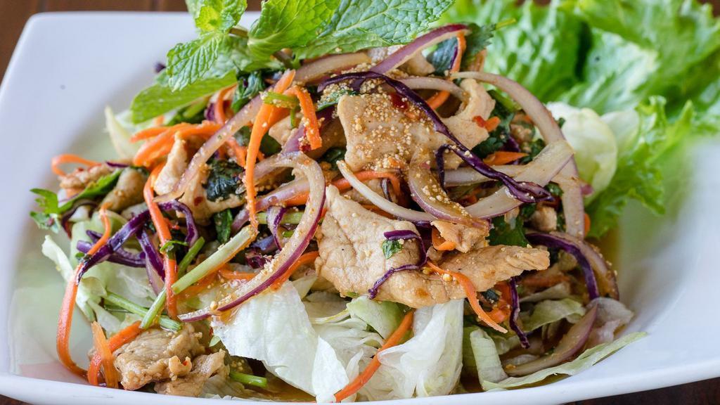 Chicken Larb · Spicy. Thai spicy salad with ground chicken, cilantro, red, and green onions, mint, crushed chilies, roasted rice powder, and lime dressing.