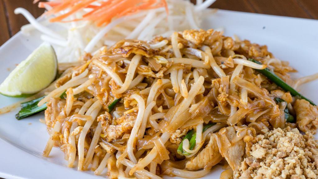 Pad Thai · Stir fried small rice noodle with tamarind sauce, egg, garlic, green onion, bean sprouts, and crushed peanut on the side.