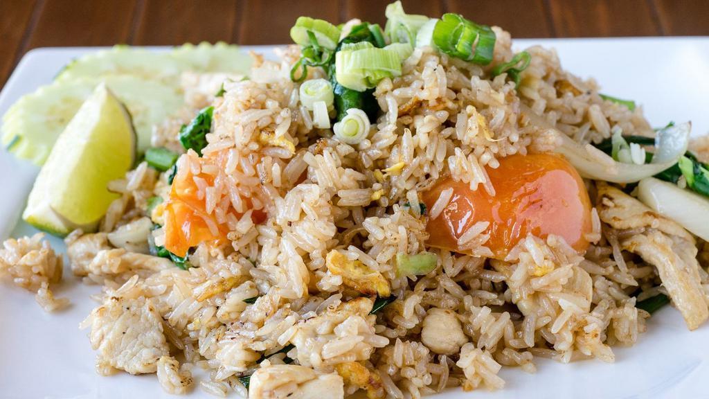 Thai Fried Rice · Fried rice with egg, Chinese broccoli, green onion, onion, tomatoes, and garlic.