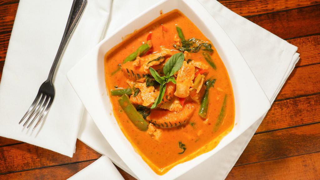 Pumpkin Red Curry · Kabocha squash, green bean, bell pepper, and Thai basil leaves in a red curry.