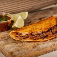 Quesabirria Taco · 1 crunchy corn tortillas, slow cooked barbacoa, monterey jack cheese, cilantro, onions, and ...