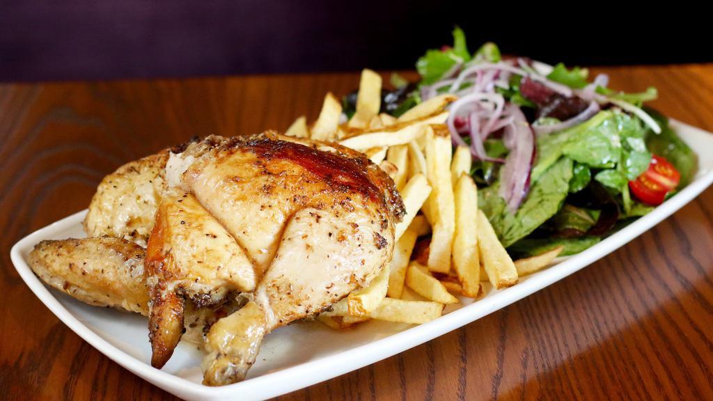 Pollo a la Brasa (Whole Chicken) · Free-range, all-natural whole rotisserie chicken, french fries, green salad, and two aji sauces.