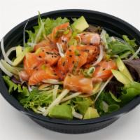 Salmon Poke Salad · Salmon, spring mix, shredded daikon, seaweed salad, sweet onion, cucumber, avocado with Orig...