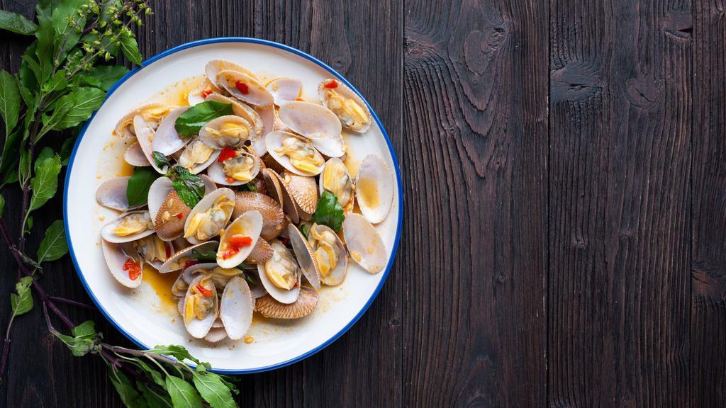 Clams with Flaming Chili Oil · Fresh clams marinated and made with flaming chili oil.