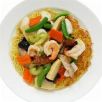 Seafood Pan Fried Noodles · Pan fried noodles with fresh seafood on top.