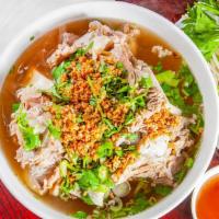 11. Hủ Tiếu Xương · Rice noodle soup with pork bone.