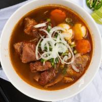 15. Mi Bo Kho · Rice egg noodies, beef stew.