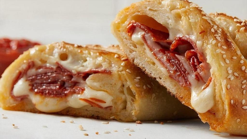Individual Pepperoni Stromboli · Pepperoni, freshly shredded 100% whole milk mozzarella and Romano cheese rolled in hand-stretched dough and baked to perfection, topped with sesame seeds. Made fresh daily..