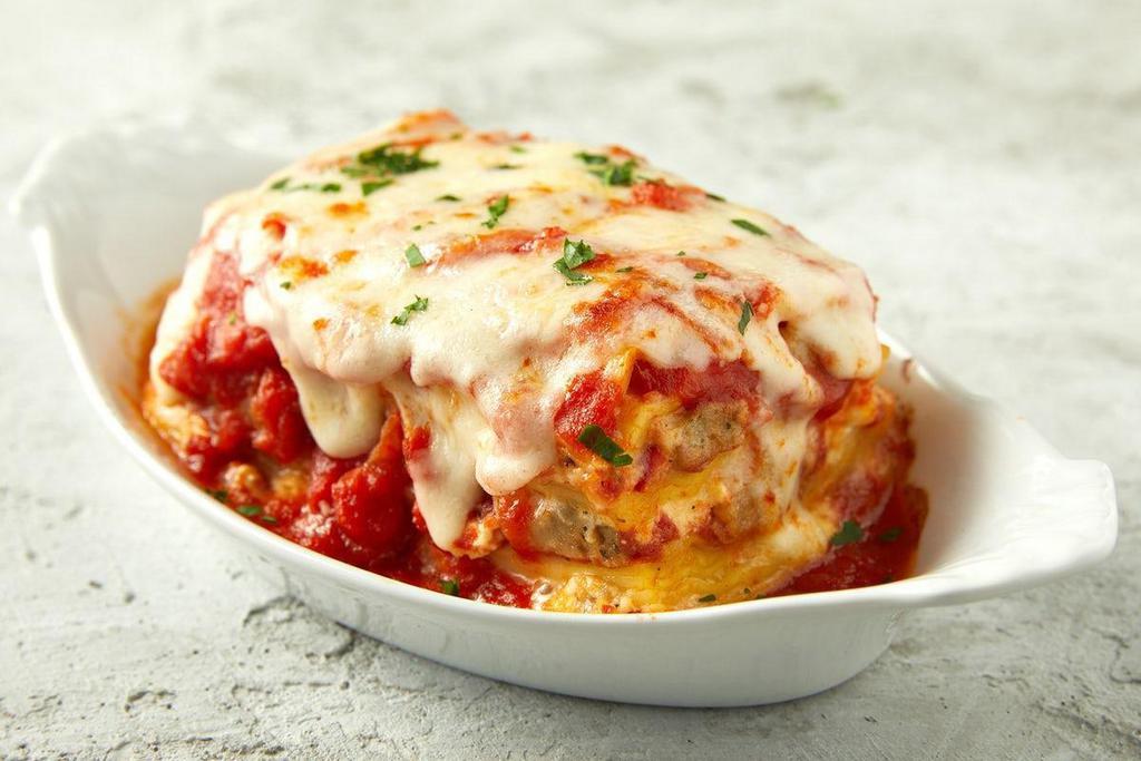 Meat Lasagna · Layered with ricotta and mozzarella cheeses, made with marinara sauce, perfectly seasoned and baked to perfection..