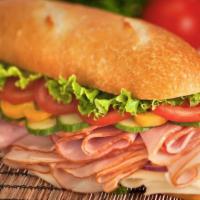 Turkey Ham Sandwich · Delicious sandwich made with Turkey Ham. Topped with lettuce, tomatoes, American cheese, and...