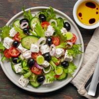 Greek Salad · Crisp romaine lettuce, house-made pickled onions and cucumbers, carrots, Kalamata olives, ba...