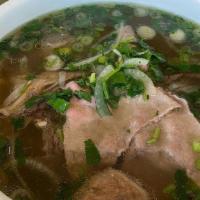 20. Phở đặc Biệt · Pho combination with rare steak, brisket and flank, tendon, tripe and meat ball.