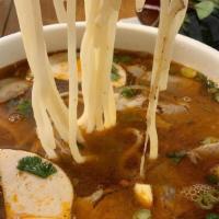 80. Bún Bò Huê · Spicy beef, rice noodles HUE style soup Vietnamese ham, flank, brisket, tendon.