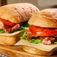 The Ham Club · Smoked ham, creamy cheese, tomatoes, red onions, and fresh lettuce, on a fresh baked ciabatt...