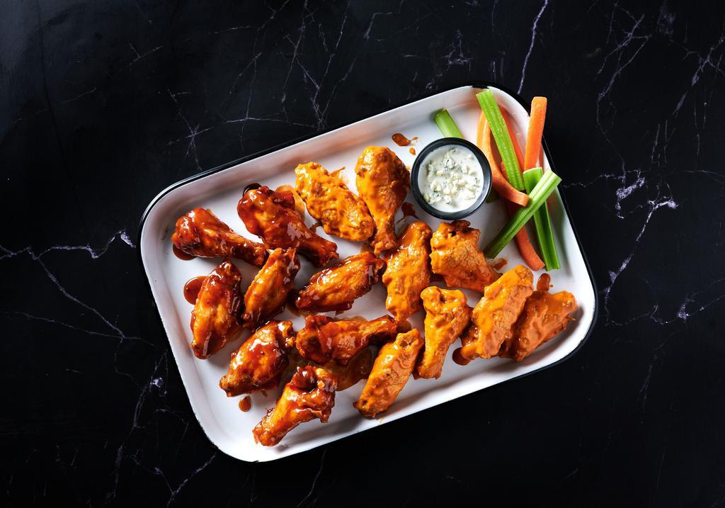 The Sweet (or Spicy!) Sixteen · A 16 count order of wings in 2 different flavors, with 2 Fries and 2 Drinks. Comes with Ranch or Blue Cheese Dipping sauces, celery and carrots